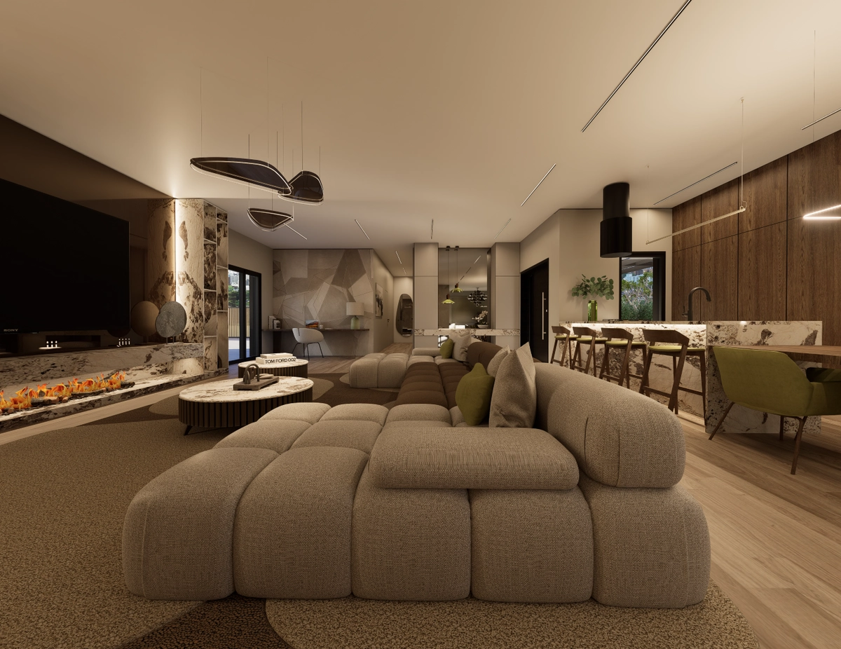 Modularna sofa u otvorenom dnevnom prostoru s tamnom kuhinjom